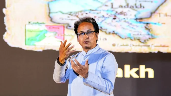Sonam Wangchuk at a protest in Ladakh, holding a banner